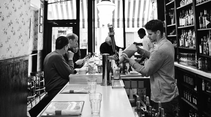 black and white image of inside an active diner